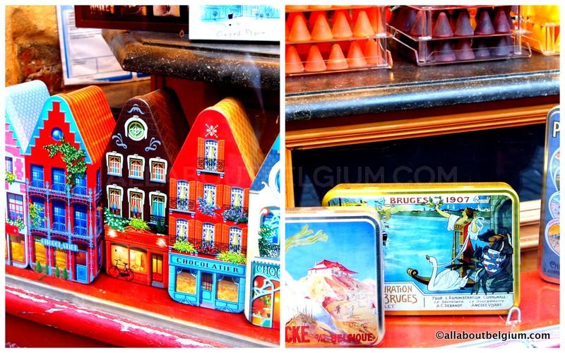 可愛すぎる「ブルージュの街並み」缶入りのチョコレート。隣は、アールヌーボーの華やかな絵がベルギーの各都市を描きます。